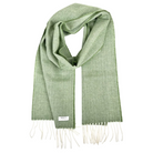 A sage green woven scarf with a subtle herringbone pattern, featuring cream-colored fringe ends.