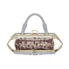 Handbag with a patterned interior on a white background