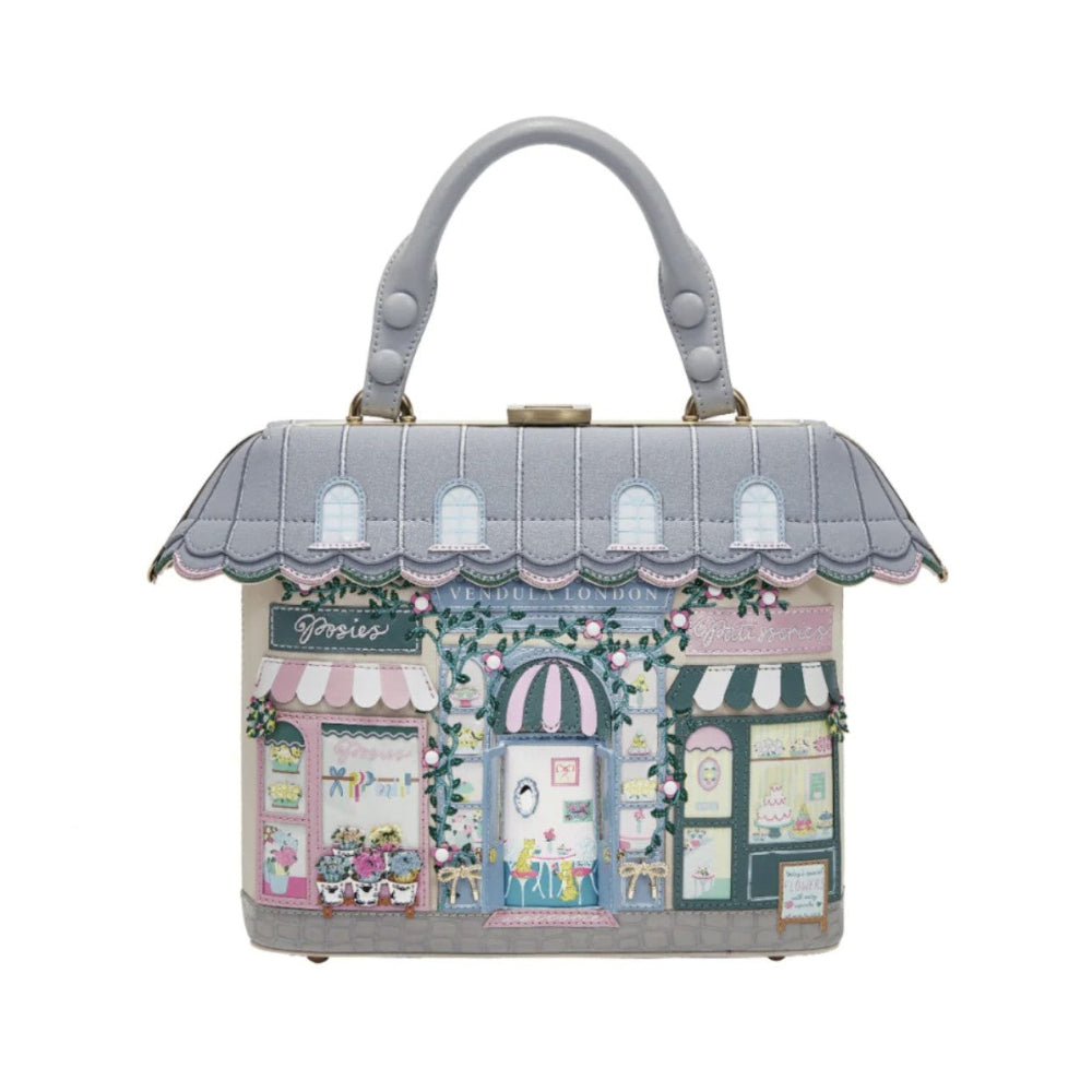 Handbag designed like a quaint village with shop fronts on a white background