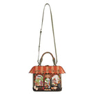 A decorative handbag with a scalloped orange and beige striped awning top, a colorful illustrated storefront front, and a long olive green shoulder strap, shown on a plain white background.
