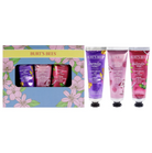 Burt's Bees hand and body care gift set featuring a floral-patterned box with three tubes of hand cream in purple, pink, and red tones.