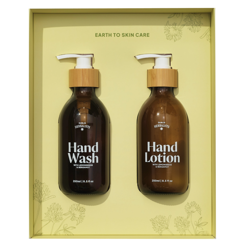 Two brown bottles of hand wash and lotion with pump dispensers in a decorative box.