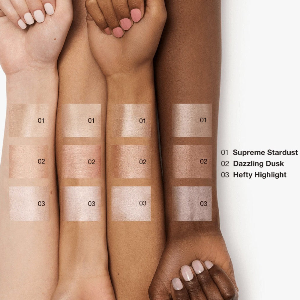 Swatch comparison on skin of different makeup shades labeled 'Supreme Stardust', 'Dazzling Dusk', and 'Hefty Highlight'.