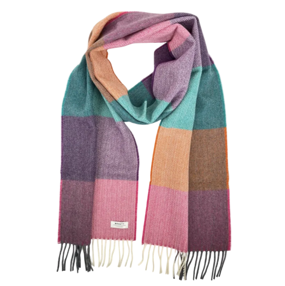 A multicolor striped knit scarf with fringed ends, featuring blocks of teal, purple, pink, and peach, displayed on a clean white background.