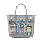 Handbag with a detailed design of a London street scene on a white background