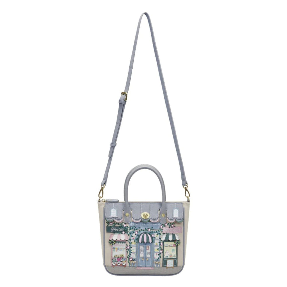 Handbag with a design of shop fronts on a white background