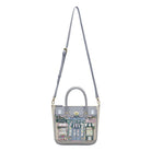Handbag with a design of shop fronts on a white background