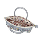 Patterned handbag with floral design on a white background