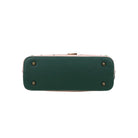 Green handbag with gold studs on a white background