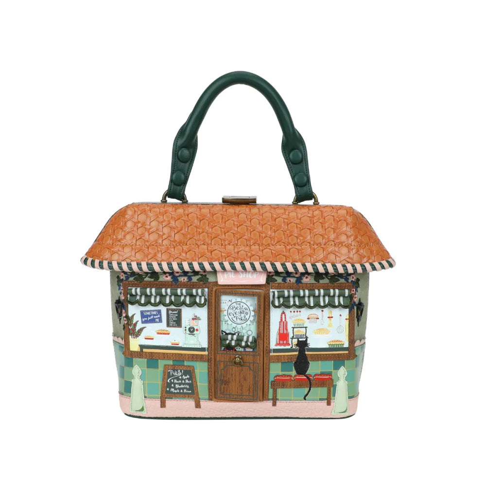 Handbag designed like a small cafe with a green handle on a white background