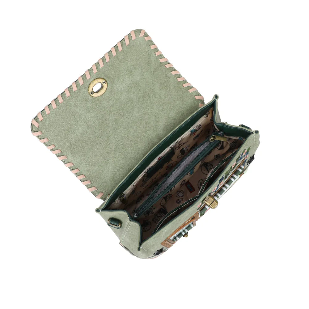 Green leather wallet with pink stitching on a white background