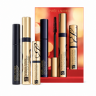 Estée Lauder makeup set featuring three cosmetic tubes and a matching red gift box on a light gray background. The set includes Little Black Primer in black packaging, Sumptuous Extreme in gold packaging