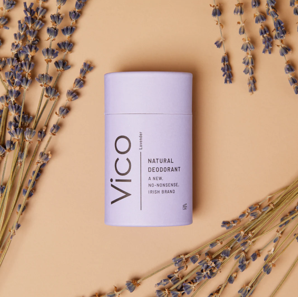 Vico natural deodorant stick surrounded by lavender on a beige background