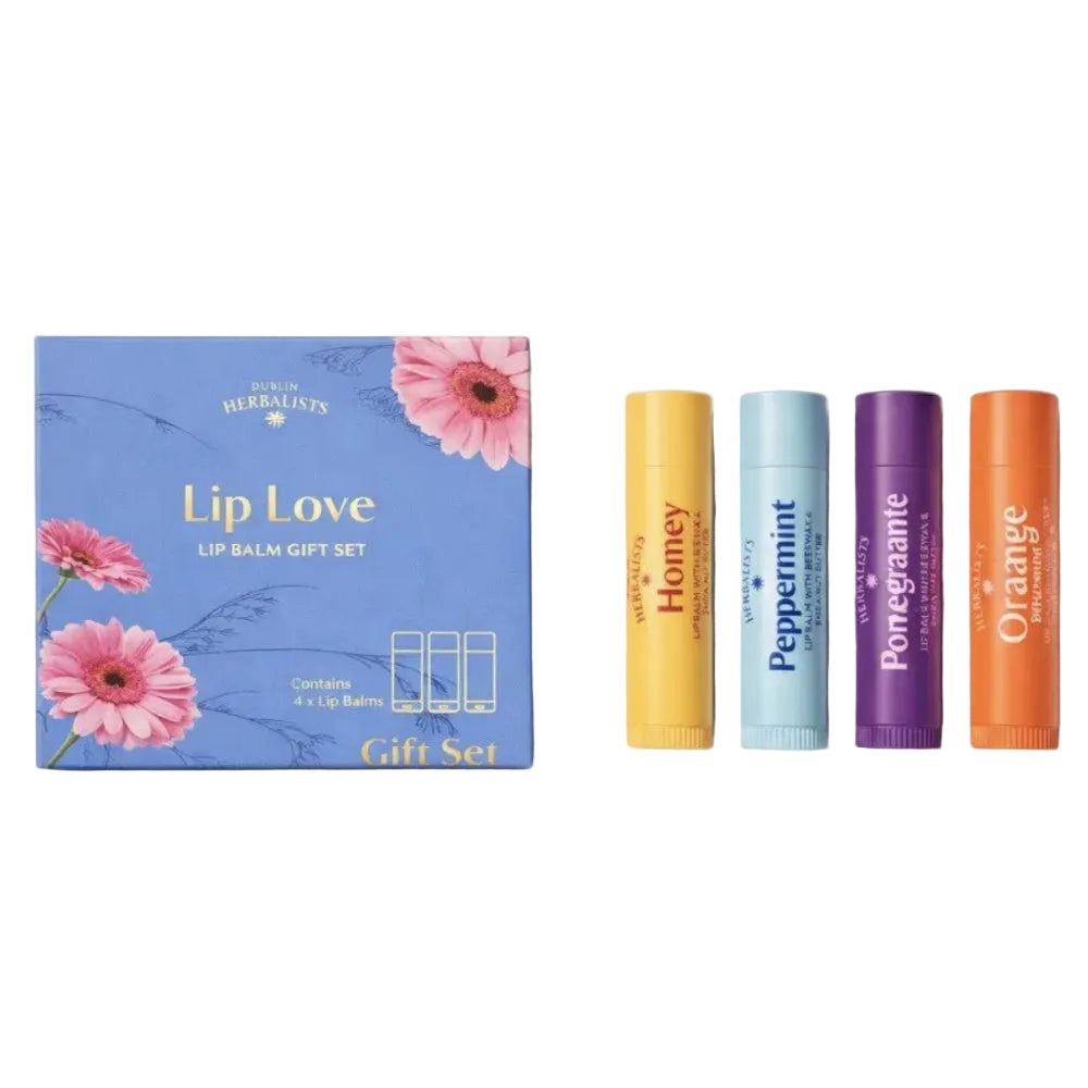 A lip balm gift set by Dublin Herbalist featuring a blue floral box labeled 'Lip Love' next to four individual lip balm tubes