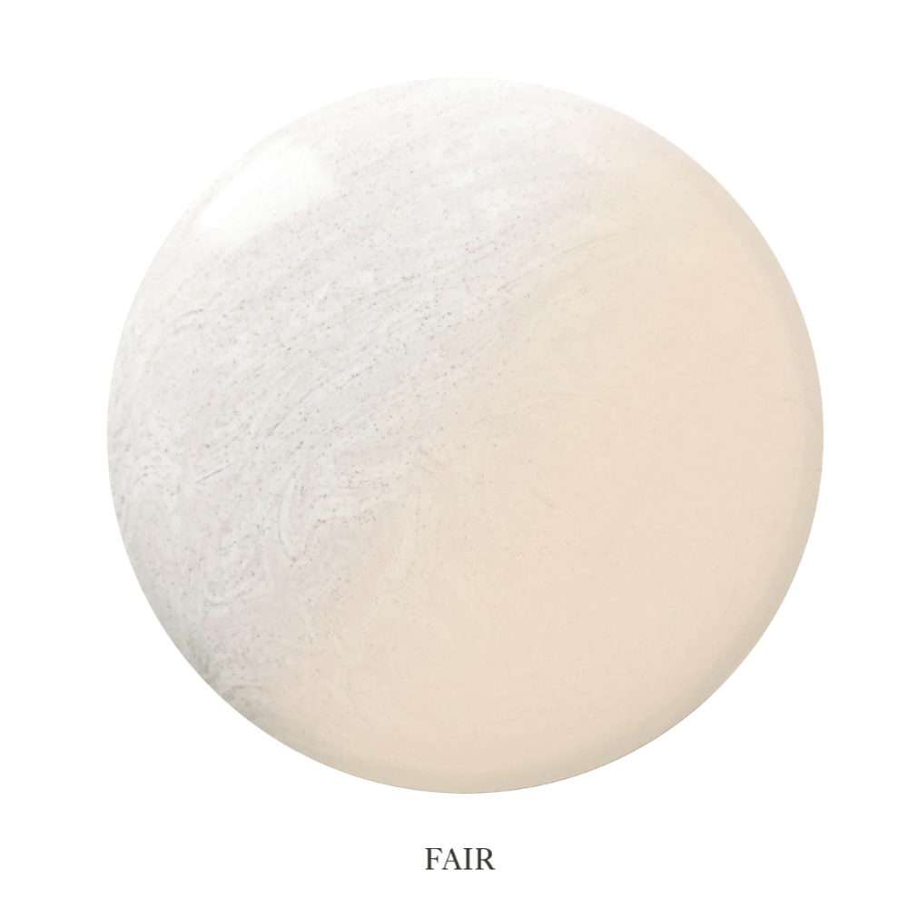 A circular color swatch labeled 'FAIR' at the bottom, showing a very light warm off-white to pale beige tone with subtle marbling on a white background.