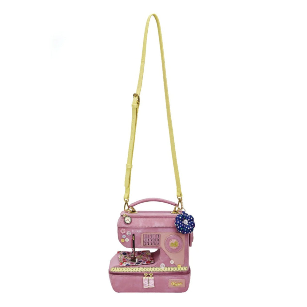 Pink sewing machine-shaped handbag with a yellow strap on a white background