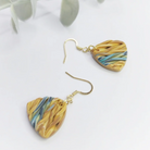 earrings in yellow and blue/teal tones