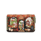 A rectangular wallet featuring a highly detailed, colourful embroidered scene of a flower shop. The design includes orange scalloped borders, potted flowers, pumpkins, and a sign reading 'VENDULA FLOWER SHOP'.