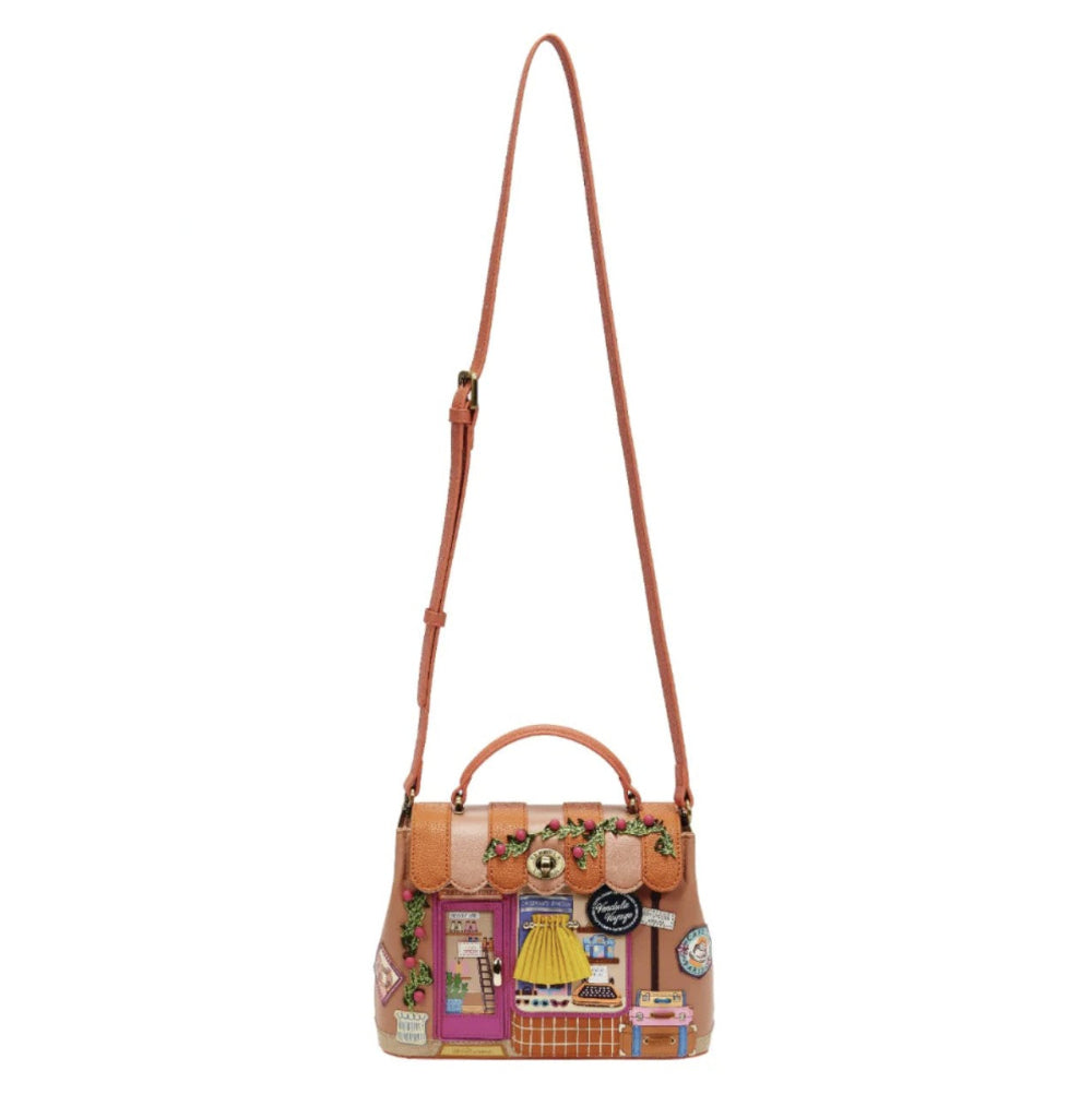 Patchwork handbag with a shoulder strap on a white background