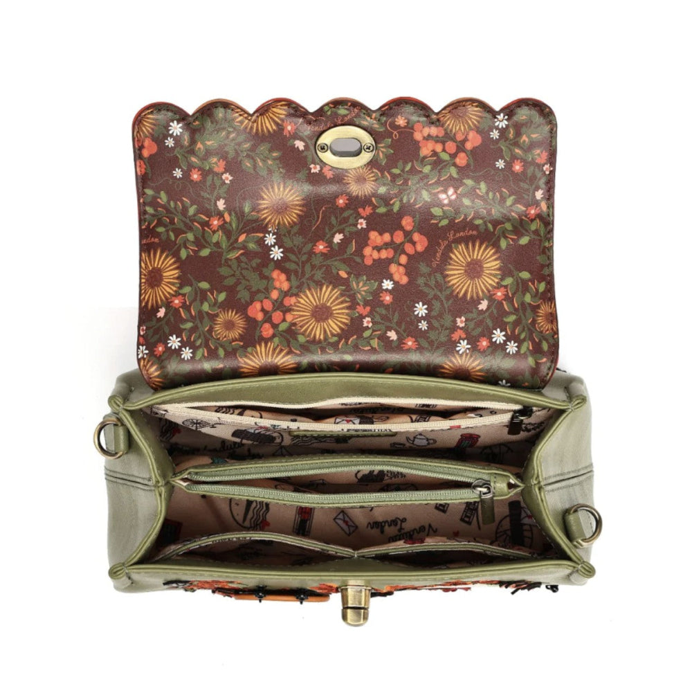 An open handbag with a scalloped top edge, featuring a brown floral patterned exterior and interior lining, olive green sides, and gold-tone hardware on a white background.