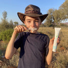 child brushing his teeth use moogoo natural mooth paste 100g
