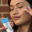 MooGoo Healthy Tinted Zinc Face Cream SPF50 swatch on models cheek