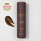 Vita Liberata mousse bottle with brown mousse sample and Women's Health Skincare Award badge on a light gray background