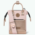 A light pink and beige Cabaia handbag with a matching pink shoulder strap, shown against a plain white background.