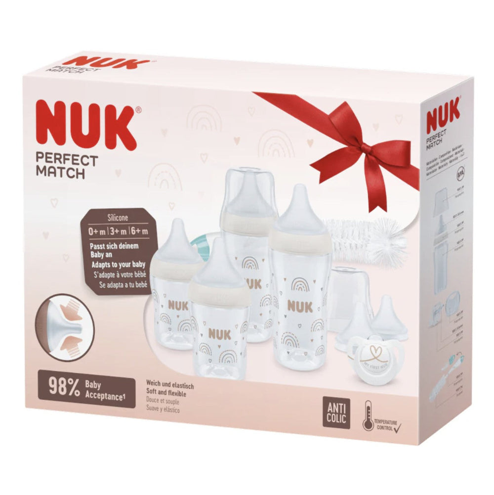 NUK baby bottle set packaging with a red bow on a white background
