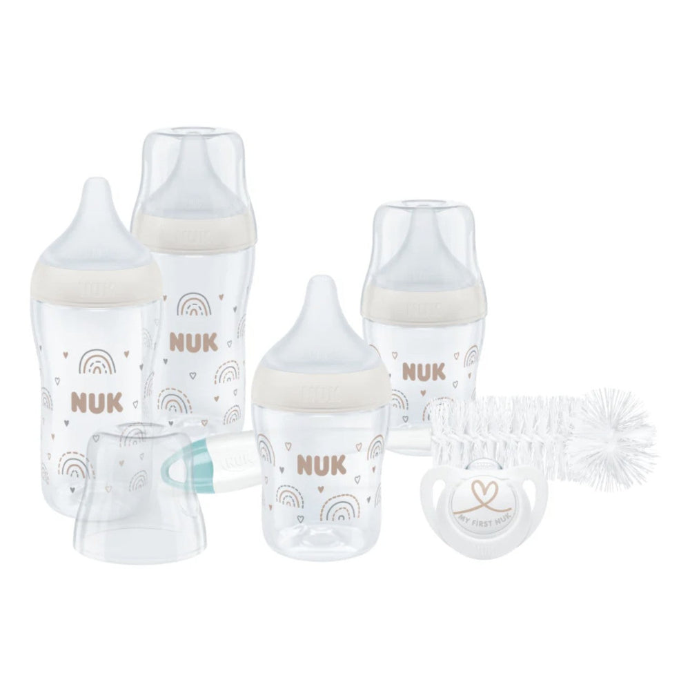 NUK baby bottles with accessories on a white background