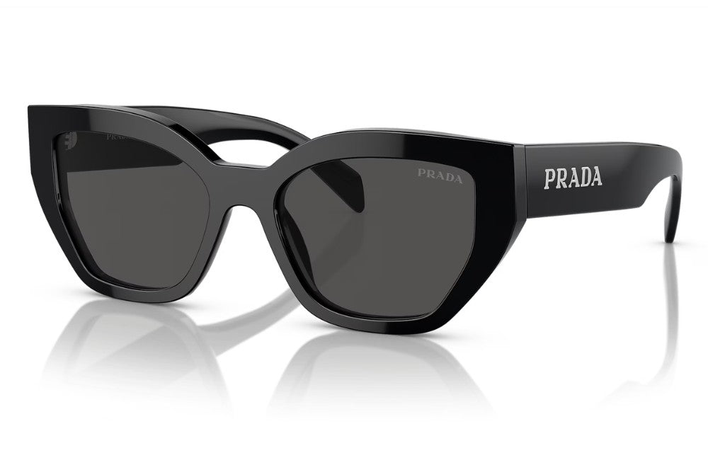Prada cat-eye sunglasses with a glossy black acetate frame and dark grey lenses, featuring the Prada logo on the temple arm