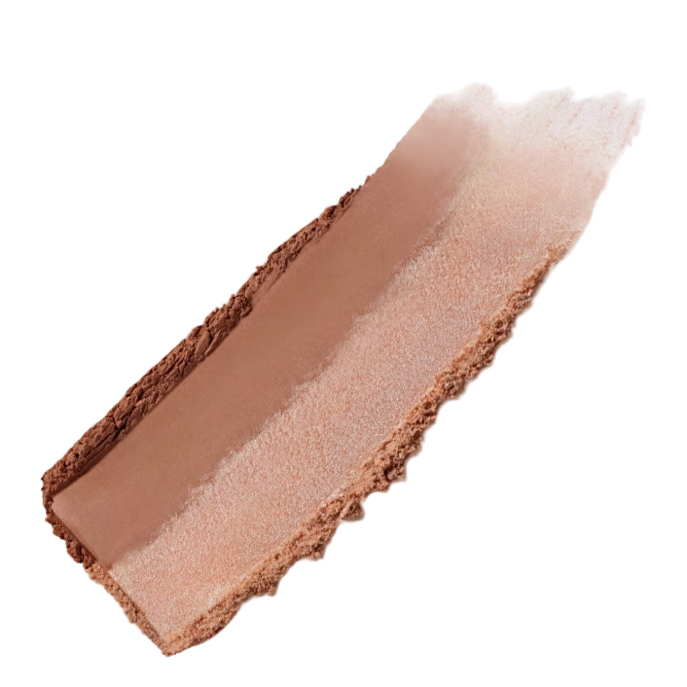 Close-up of a makeup swatch with brown and beige tones on a light gray background