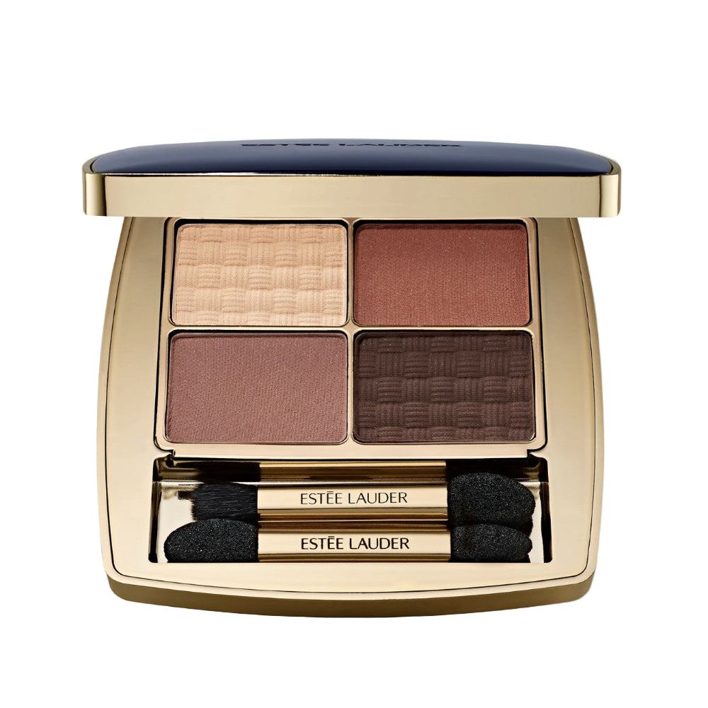 Estée Lauder eyeshadow palette with four shades and two applicators on a light gray background