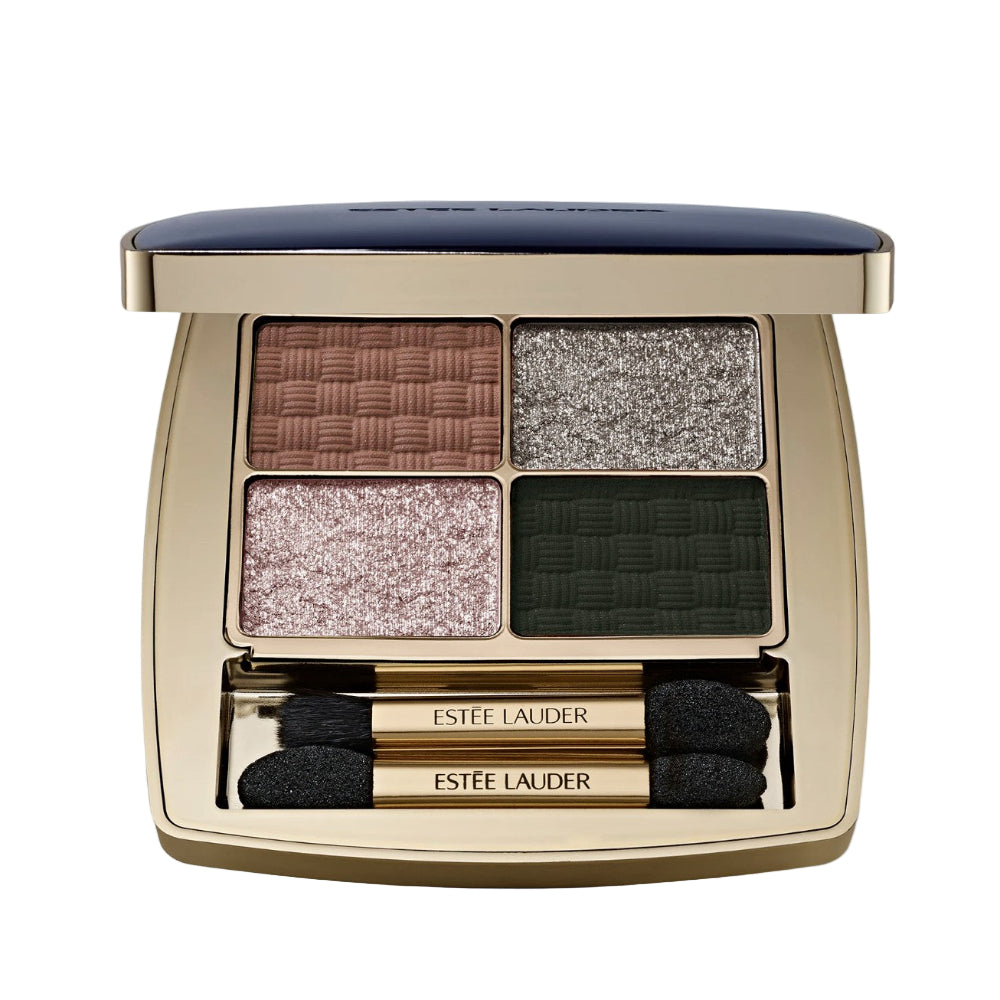 Estée Lauder eyeshadow palette with four colors and two brushes on a light gray background