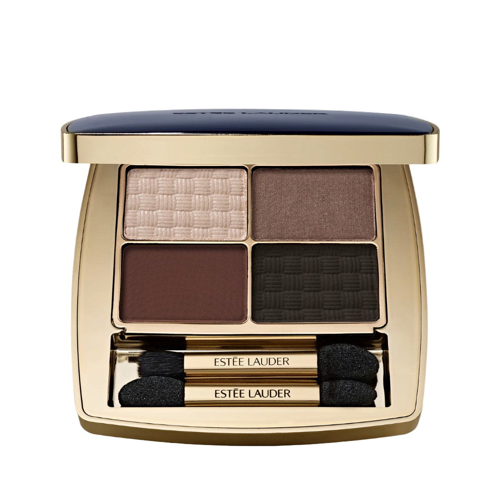 Estée Lauder eyeshadow palette with four shades and two applicators on a light gray background.