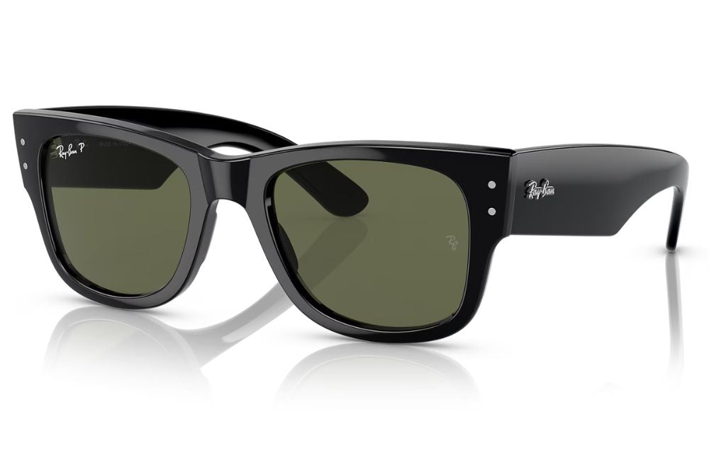 Black sunglasses with gold accents on a white background