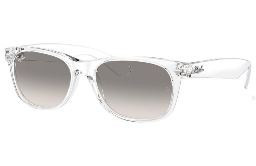 Ray-Ban Wayfarer-style sunglasses with a transparent clear acetate frame and gradient gray lenses