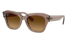 Brown sunglasses with a gradient lens on a white background