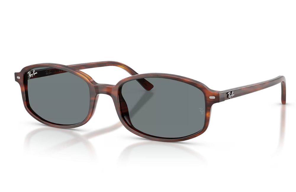 Sunglasses with tortoiseshell frame and dark lenses on a white background