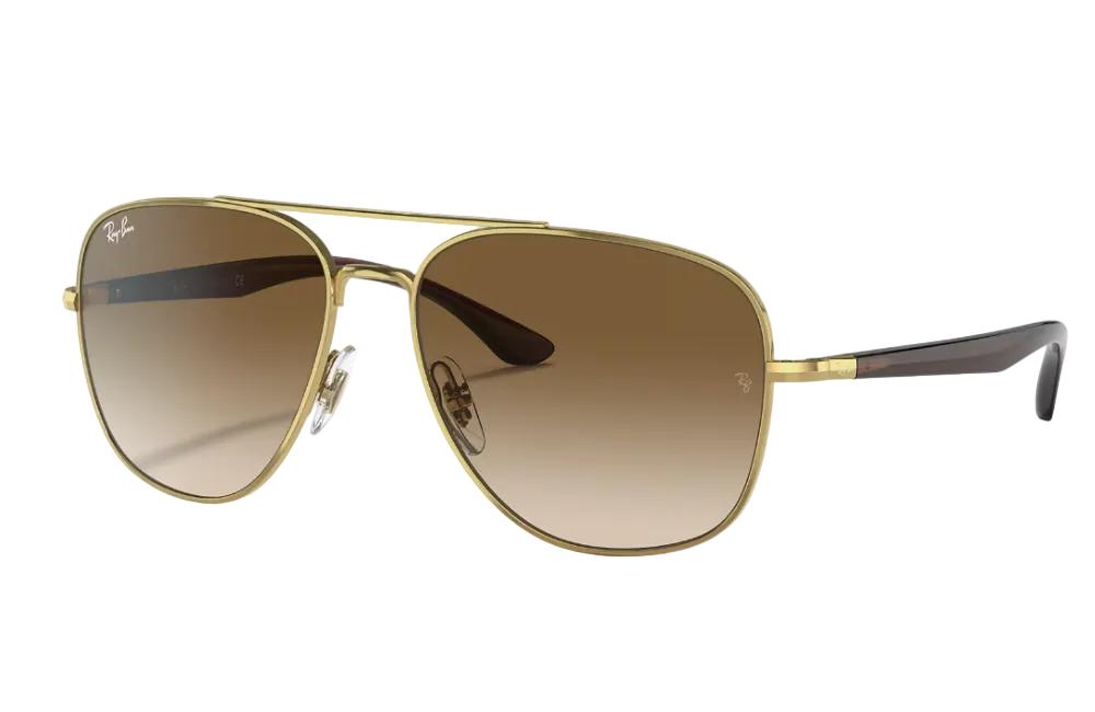 Gold-framed sunglasses with brown gradient lenses on a light gray background
