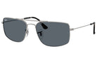 Silver sunglasses with dark lenses on a white background