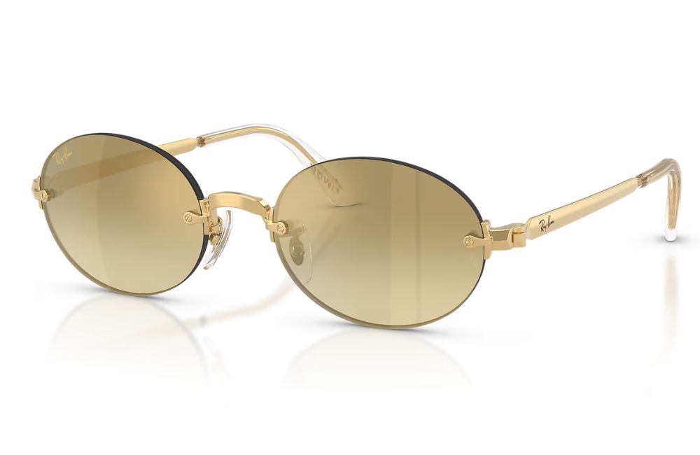 Ray-Ban oval sunglasses with gold metal frames and gradient brown-tinted lenses