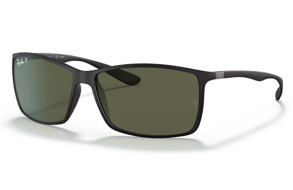 Black sunglasses with green lenses on a white background