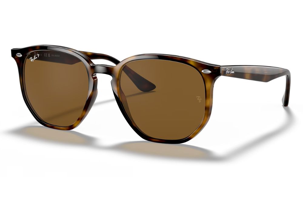 Brown sunglasses with tortoiseshell frame on a white background