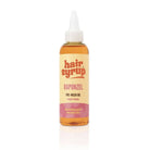 A bottle of hair syrup Rapunzel Pre-Wash Oi;
