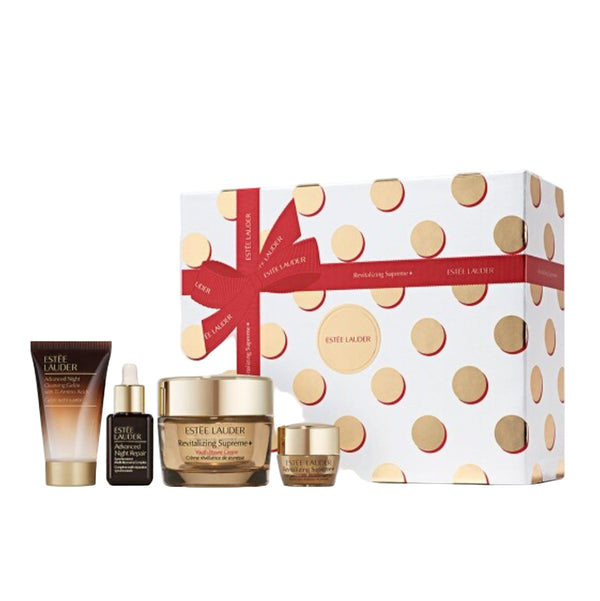 Estée Lauder skincare set with polka dot box on a light gray background