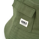 Roka Hatfield Garden Bucket Hats avcado side pocket close up