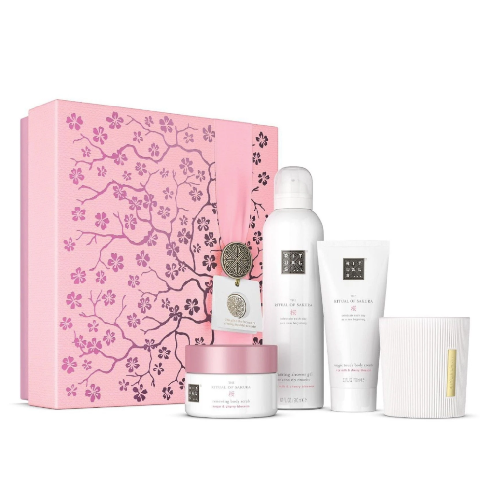 Skincare product set with a pink floral box on a white background