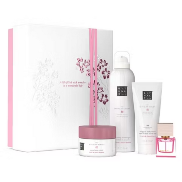 Set of skincare products including a box, jar, bottles, and a small bottle with a pink cap on a white background.