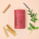 Vico natural deodorant canister with wooden sticks and lavender on a beige background